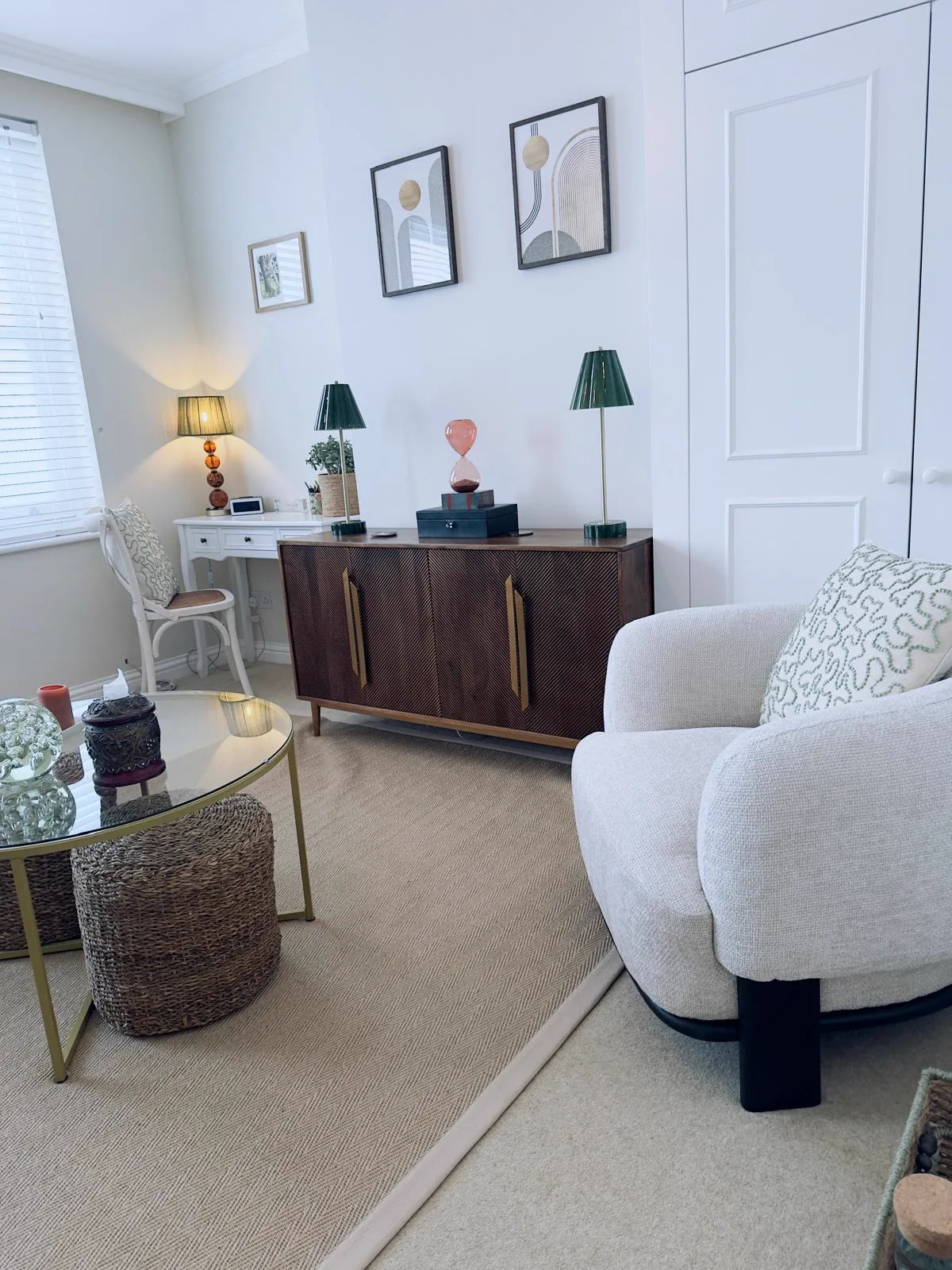 Therapy room at Wainwright Family Support showing mid-century sideboard and cosy armchair in Barnes, London